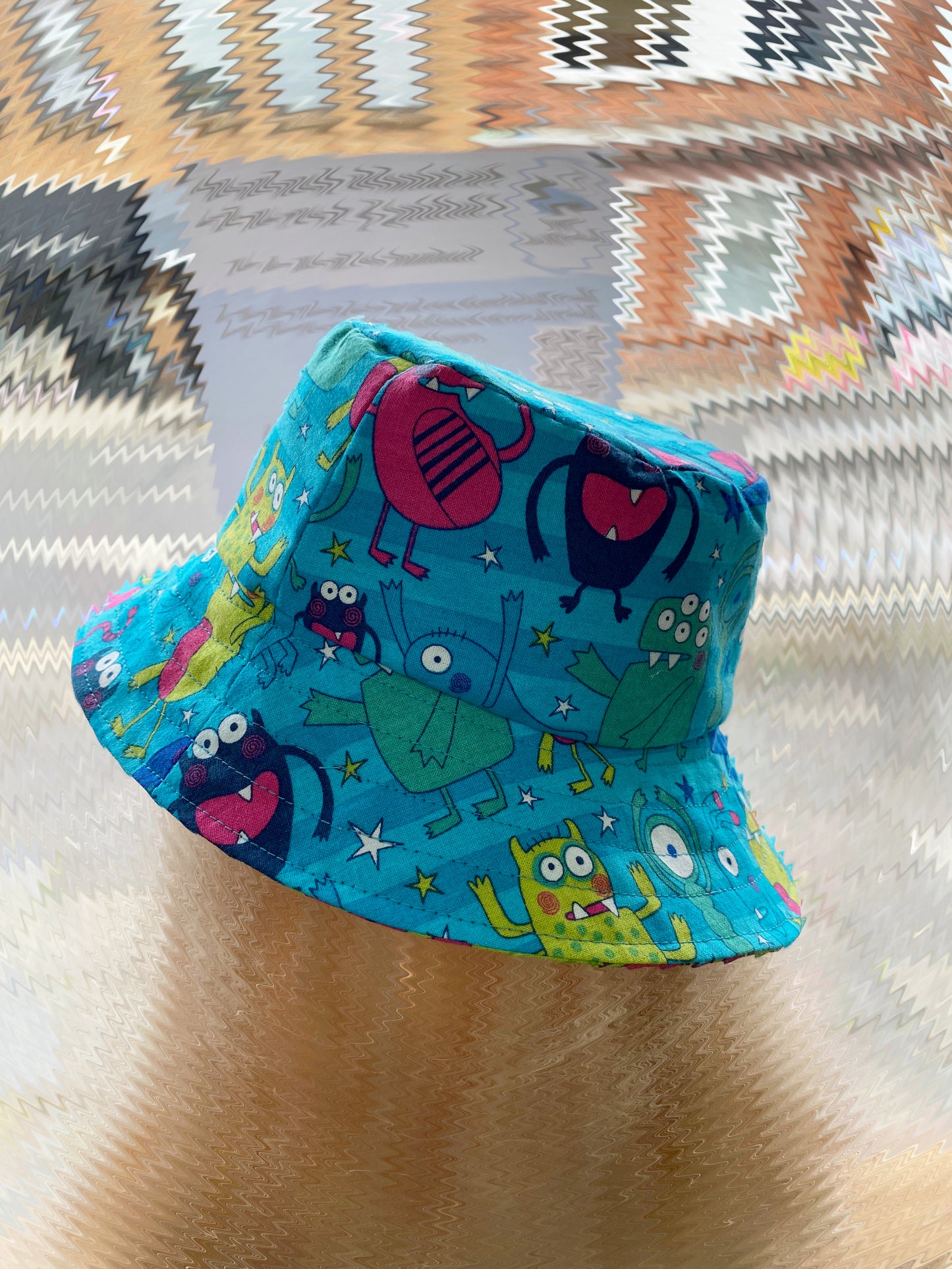 Blue/Pink Monsters Reversible Bucket Hat 2-4 years